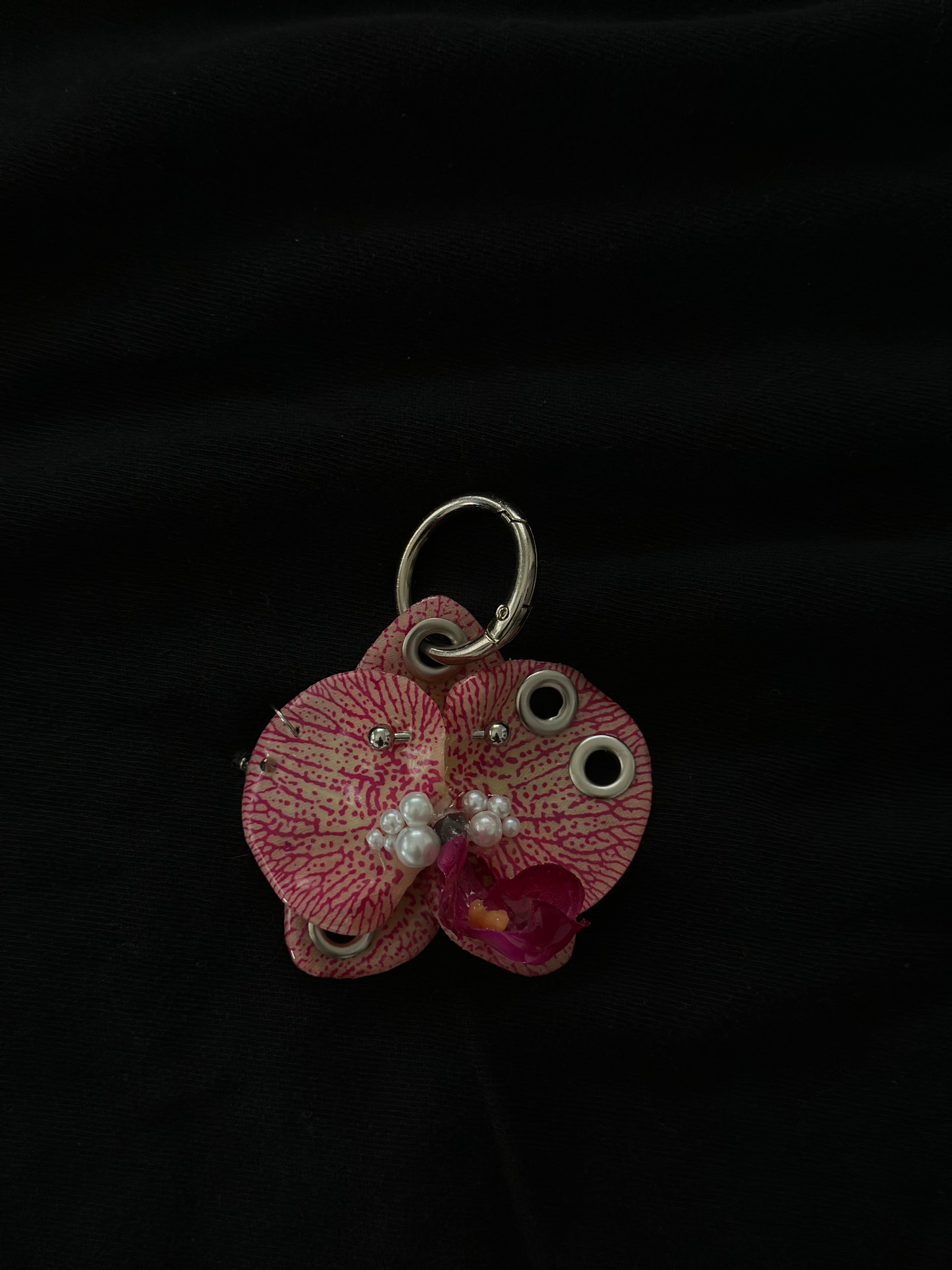 Pink Pierced orchid keychain with silver hardware