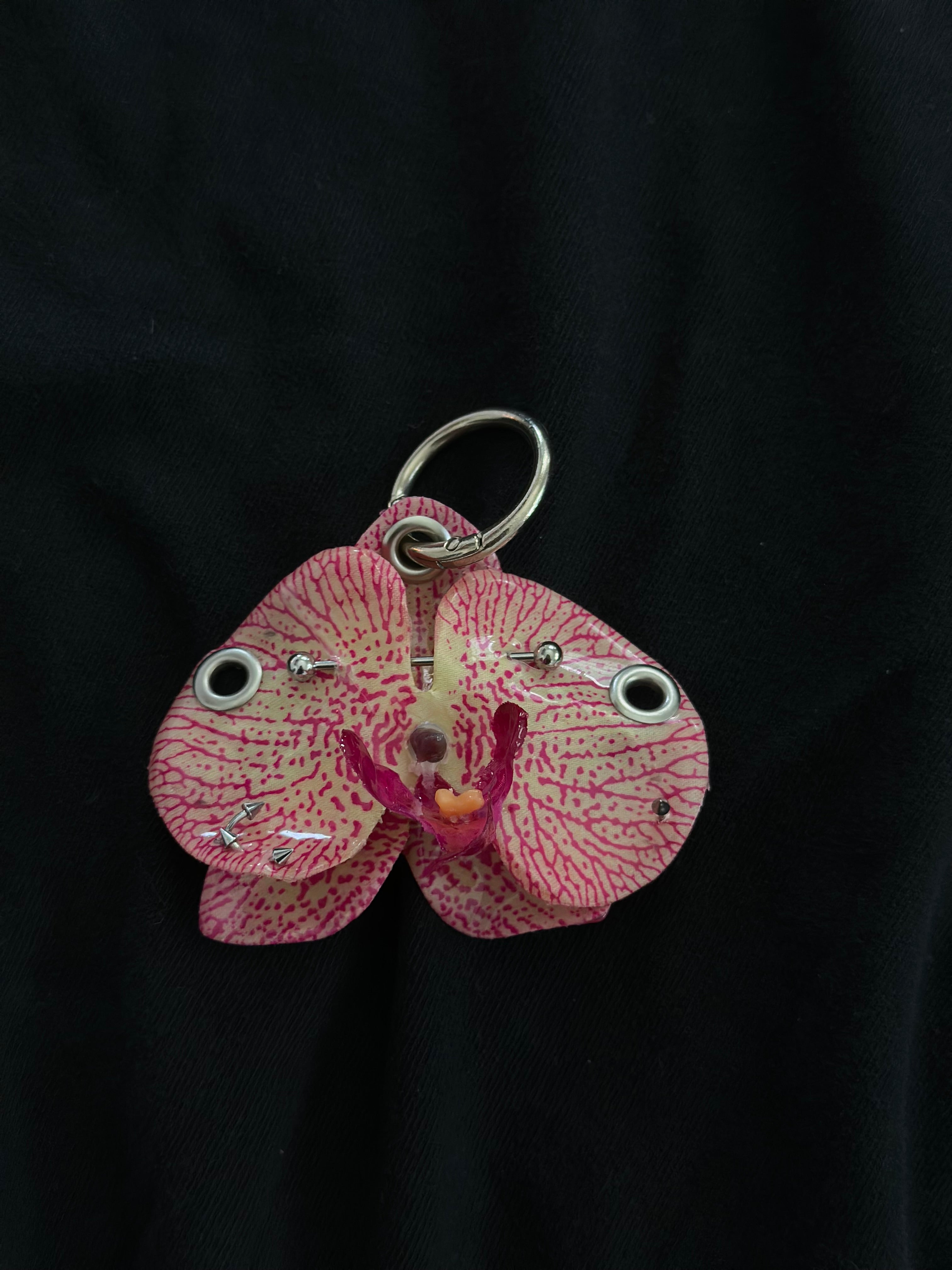 Pink Pierced orchid keychain with silver hardware